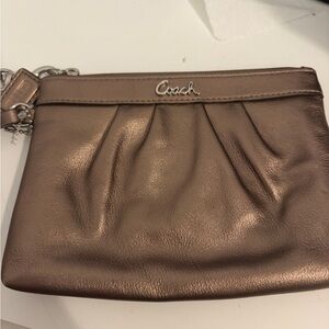 NWT Coach bronze wristlet clutch